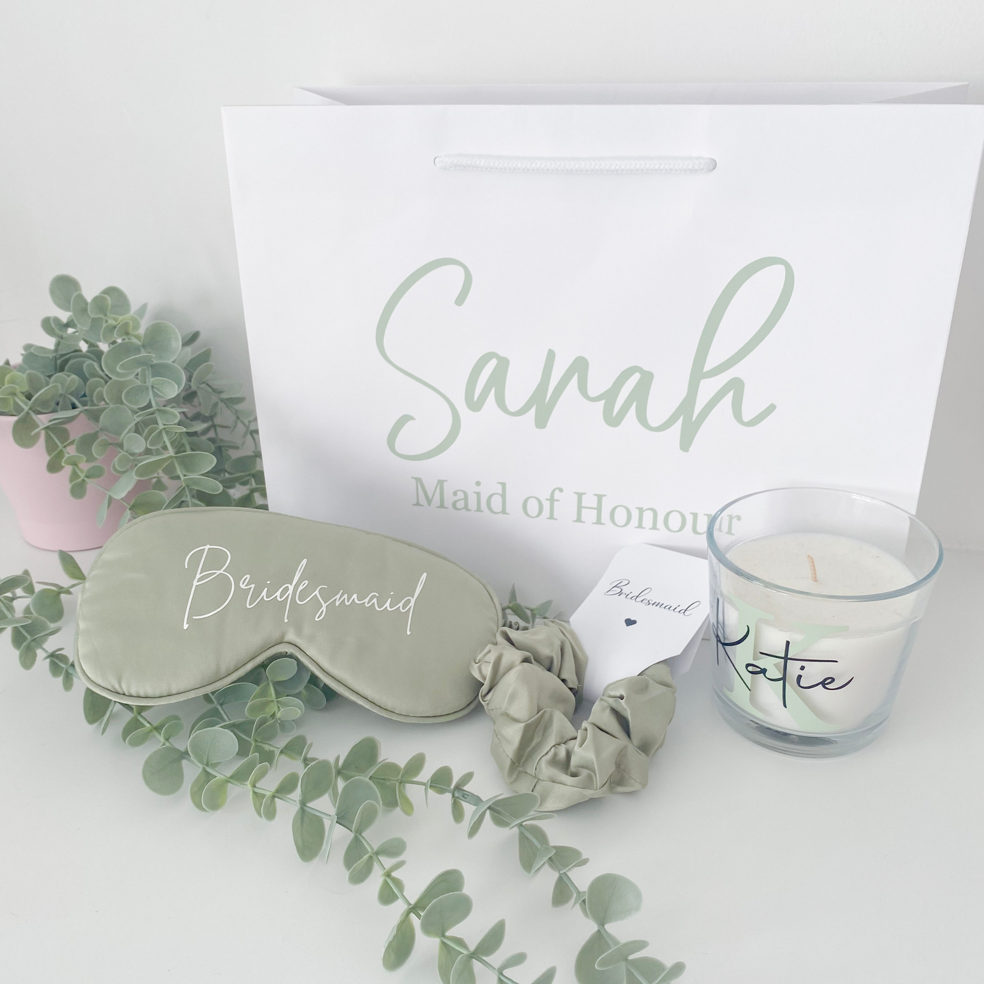 Sage green personalised bridal party gift bag with bridesmaid gifts inside, styled for a UK wedding in 2025 with a botanical colour theme.
