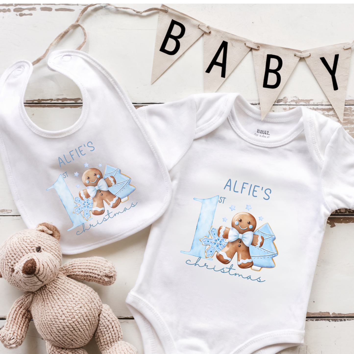 Baby bib and onesie with gingerbread design and 'Alfie's 1st Christmas' text on.