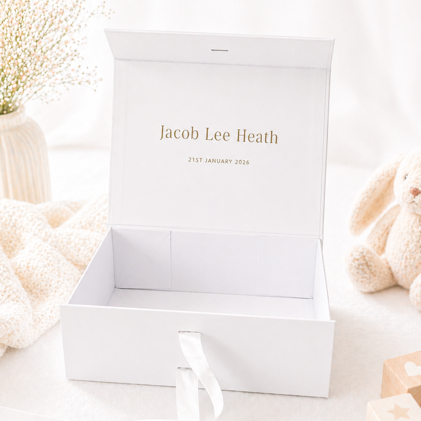 Open baby gift box with personalised message inside