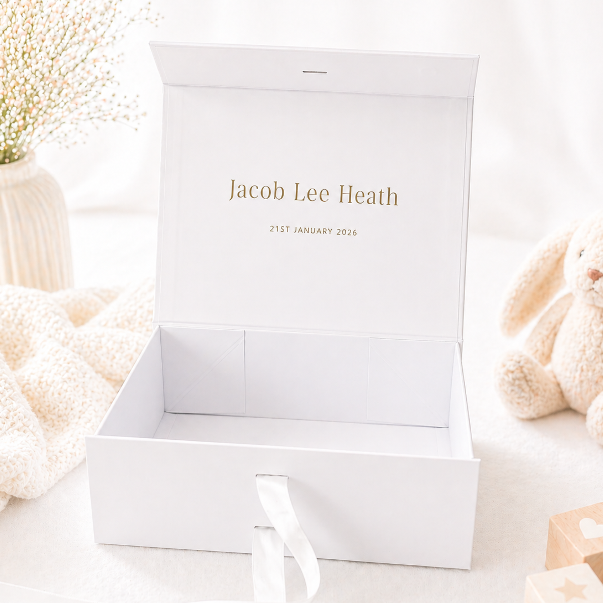 Open baby gift box with personalised message inside