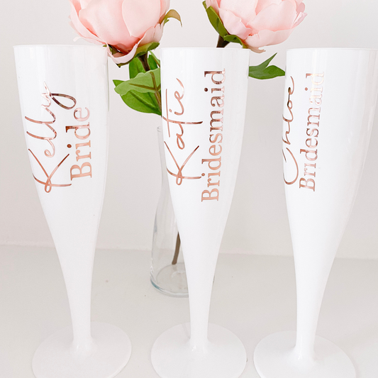 white plastic champagne flute for bridal party. Personalised with name and role